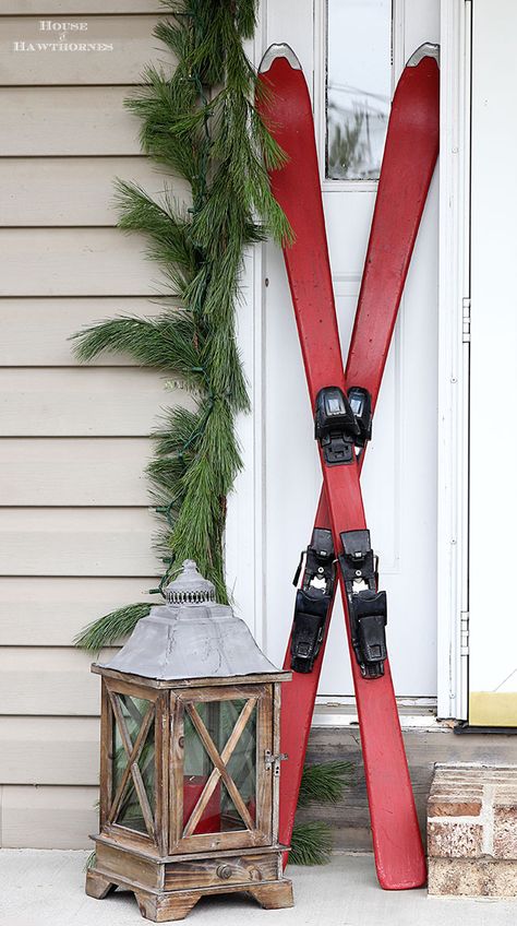 DIY chalk painted skis for festive holiday porch decor Winter Porch Decorations, Ski Decor, Winter Porch, Reindeer Decorations, Christmas Front Porch, Christmas Porch Decor, Festive Holiday Decor, Christmas Porch, Front Porch Christmas Decor