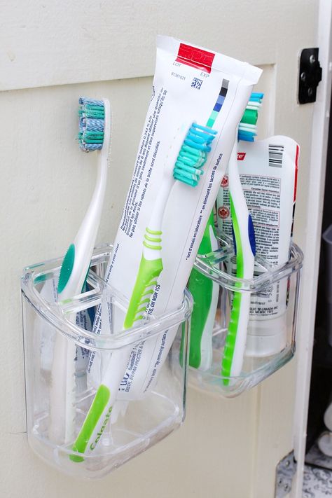 Lots of easy ways to organize the bathroom! Use the inside of cabinet doors to hold toothbrushes. Vessel Sink Vanity, Toothbrush Organization, Bathroom Cabinet Organization, Bathroom Hacks, Small Bathroom Organization, Bathroom Organization Diy, Toothbrush Storage, Bathroom Storage Cabinet, Cabinets Organization