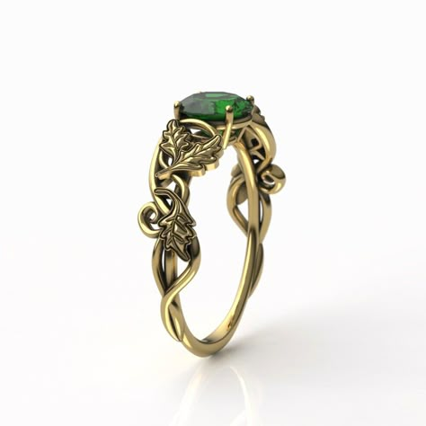 "To see our entire Elven collection, click here: https://www.etsy.com/shop/MetalWendler?ref=seller-platform-mcnav&search_query=elvish This Woodlands Oak Leaf Fantasy themed engagement ring is made from recycled gold and is handmade with a comfort fit to your size. Ring Specs: ● 6.5mm Round Lab Emerald, ~1ct (Cut weight varies: ~0.94-1 carat). ● Band is 4.7mm at widest point, then tapers thinner towards the bottom for an elegant curve. ● Metals: 10-18k yellow gold. This ring is available with Emerald Gemstone Engagement Ring Gold, Celtic Engagement Rings Vintage, Art Nouveau Rings, Elven Ring Engagement, Elf Engagement Ring, Lord Of The Rings Engagement Ring, Elven Engagement Ring, Elvish Engagement Rings, Elven Accessories