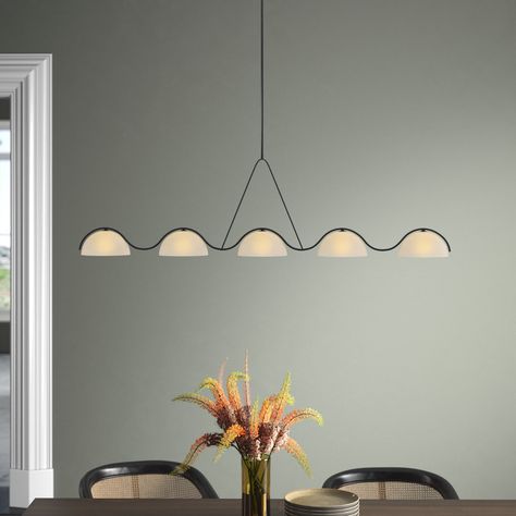 The next focal point for your living room or dining area. Designed by Kelly Wearstler, this 5-light linear chandelier illuminates your space and brings a bold mid-century modern vibe to any room. The frame is crafted from metal with a matte black finish and a wavy silhouette, while five white glass dome shades filter the glow from corresponding bulbs that are sold separately and dimmable. This piece hangs with the help of a downrod and a canopy that's compatible with sloped ceilings. It's also d Minimalist Dining Room Light Fixture, Linear Chandelier Over Island, Chandelier Over Island, Lights Over Dining Table, Modern Linear Chandelier, Dining Room Light Fixture, Minimalist Dining Room, Peach Tree, Cottage Renovation