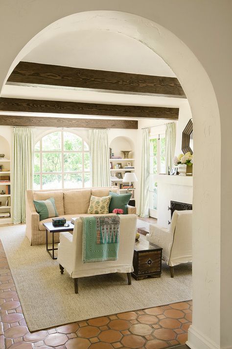 blanket on chair Mediterranean Living Room with Wood Ceiling Beams and Arched Doorway Pretty Living Room, Mediterranean Living Room, Tile Floor Living Room, Mediterranean Living, Terracotta Floor, House Of Turquoise, Design Apartment, A Living Room, My Dream Home