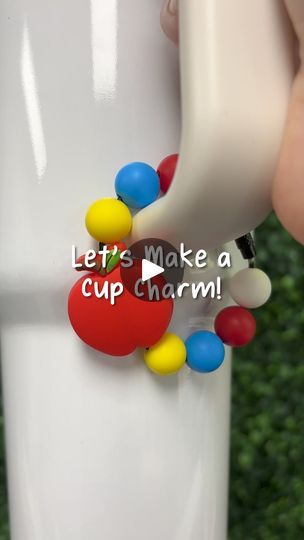 🍎 Stylize your cups and tumblers with your very own apple cup charm - great for teachers looking to add a little fun to their drinkware! ✨  ✂️ Materials - •  Silicone Focal Bead Apple - Red  • Silicone Bead Round - Scarlet Red, Deep Sky Blue, Yellow • Beadable Charm Tumbler Cable - Black    🌟 Want to recreate this project? Check out our website for all your crafting needs at diycraftwarehouse.com   #siliconebeads #beads #cupcharm #howto #backtoschool | DIY Craft Warehouse Diy Stanley Cup Accessories, Tumbler Charms Diy, Cup Charms, Silicone Bead Pens Diy, Stanley Cup Charms Diy, How To Make Silicone Bead Pens, Diy Stanley Cup Charm, Mickey Mouse Silicone Bead Keychain, Apple Cup