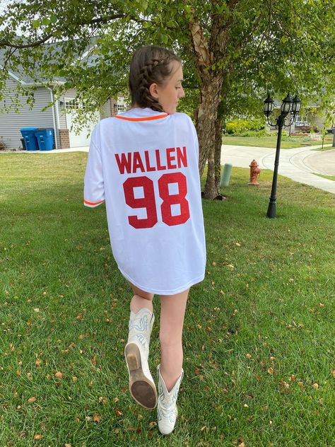 Super cute Morgan Wallen Jersey!  Can be customized! Fits a little big, I am wearing size Small in the picture and I'm 5'5. Morgan Wallen Jersey, Morgan Wallen Outfit, 98 Braves, Braves Jersey, Morgan Wallen, Baseball Jersey, Baseball, T Shirts