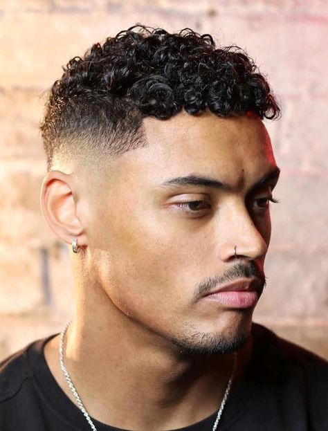 Perfect Mid Fade with Sharp Line Up - If you’re after a mid fade that’s great for curly hair, look no further. This style allows the hair’s curly nature to shine through and uses the mid fade to add tidiness. Medium Fade Haircut Curly Hair, Haircuts Fir Natural Curly Hair Men, Men’s Curly Haircut Black, Mixed Hair Men Haircut, Skin Fade Haircut Men Curly, Mid Fade Haircut Curly Hair, Men Curly Hairstyles Black, Mid Fade With Curly Hair, Dominican Hairstyles Men