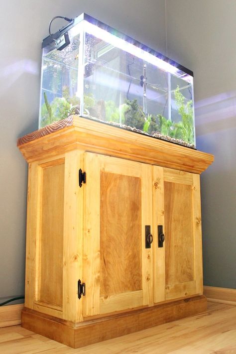 This DIY aquarium stand from Woodshop Diaries features matching hinges and pulls from D. Lawless Hardware! Diy Aquarium Stand, Fish Tank Cabinets, Aquarium Cabinet, Aquarium Stands, Fish Tank Stand, Free Building Plans, Diy Fish Tank, Woodworking Desk, Tank Stand