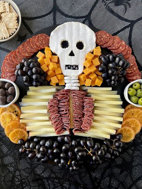 When it comes to scare-cuterie, it doesn’t get much more spooktacular than this skeleton charcuterie board. This halloween, whether you’re hosting or ghosting, whip up this adorable halloween snack. You’ll use sliced manchego and blueberry jam-filled brie to make the skeleton, then fill it with salami innards! And no board is complete without some produce and accouterments–feel free to tailor them to your tastes! Skeleton Charcuterie Board, Skeleton Charcuterie, Halloween Apps, Halloween Charcuterie Board, Yogurt Covered Pretzels, Halloween Charcuterie, Easy Halloween Food, Halloween Food Treats, Halloween Foods