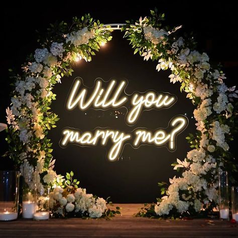 "WILL YOU MARRY ME?" Width: 2.5 feet Height: 1.65 feet  Why Choose Our Custom Wedding Neon Signs? We believe every couple is unique, and their wedding sign should be too. Share your ideas with us, and we'll work together, refining concepts and designs until we capture the essence of your perfect piece. Exceptional Quality & Craftsmanship: Crafted with premium LED technology on high-grade acrylic boards, our neon signs are designed to dazzle your guests and serve as a lasting memento of your love Will You Marry Me Neon Sign, Will You Marry Me Decorations, Will You Marry Me Sign, Will You Marry Me Ideas, Will You Marry Me, Marry Me Sign, Marry Me Proposal, Cute Proposal Ideas, Celtic Magic