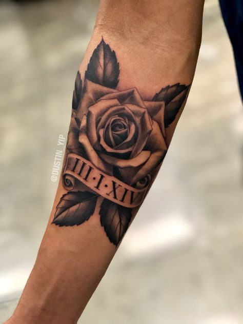 Mens Cross And Rose Tattoo, Rose And Date Tattoo Men, Rose Tattoo Design Black And Grey, Men's Rose Tattoo, Tattoos With Names In Them For Men, Rose Tattoo With Birth Year, Rose Tattoo Arm Man, Masculine Rose Tattoo Men, Manly Rose Tattoo Men