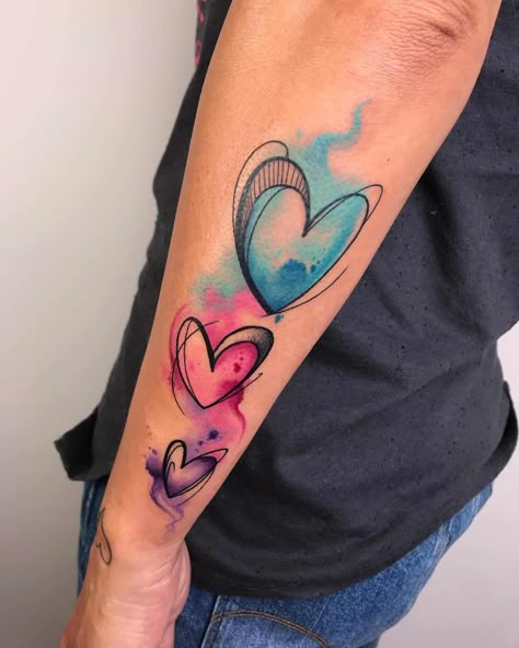 Watercolor Heart Tattoos 3 Watercolor Heart Tattoos, Heart Tattoo Ideas, Watercolor Butterfly Tattoo, Colour Tattoo For Women, Watercolor Rose Tattoos, Colorful Tattoo, Heart Watercolor, Heart Tattoo Designs, Watercolor Heart