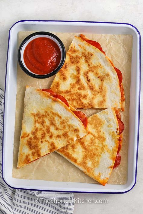 Pizza quesadilla is an easy, cheesy recipe that’s perfect for busy days! All you need are tortillas, pizza sauce, shredded cheese, and pepperoni to whip up this crispy, golden delight. Cook it in a skillet, serve it with extra pizza sauce for dipping, and you've got a quick, satisfying snack or dinner that’ll be a family favorite. It’s everything you love about pizza in a quesadilla form, and it’s ready to enjoy in no time! #theshortcutkitchen Recipe For Monkey Bread, Tortillas Pizza, Baked Cornish Hens, Easy Vegetable Dishes, Frozen Carrots, Pizza Tortilla, Carrot Casserole, Monkey Bread Recipe Easy, Pizza Quesadilla