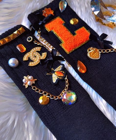 ✨ Step Up Your Sock Game with Gaudy Jeweled Socks by B.eaded E.verything! ✨ 💎 Shine Bright: Elevate your footwear with our stunning Gaudy Jeweled Socks, adorned with sparkling gems and personalized initials! Perfect for adding a touch of glam to any outfit. 🌟 Why You'll Love Them: Personalized with your initial for a unique touch ✨ Perfect for gifting or treating yourself 🎁 A blend of comfort and dazzling style 💖 🔥 Hurry, limited stock available! Don't miss out on the chance to own these fabulous socks and make every step a statement! #GaudyJeweledSocks #PersonalizedFashion #BeadedEverything #SockStyle #FashionAccessories #ShopNow #GlamUp #SparkleAndShine Caring for Your Gaudy Junkie Jeweled Socks by ✨ B.eaded E.verything by "The Croc Doc" 💕🐊 To keep your Gaudy Junkie Jeweled Socks Sock Ideas, Bling Socks Outfit, Charm Socks, Customized Socks, Bedazzled Socks, Slouch Socks With Charms, Junk Socks With Charms, Slouch Socks Outfit, Bejeweled Socks