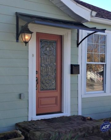 The Black metal Concave Awning with the Smith Scrolls in Chester Springs, PA. Front Door Awning Ranch House, Small Awning Over Garage Doors, Front Door Awning Panel, Window Awnings Exterior Door Canopy, Front Door Awning Lowe's, Front Door Overhang, Awning Over Door, Front Door Awning, Over Door Awnings 6’ Out