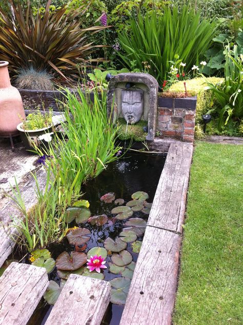 This unusual water feature using reclaimed railway sleepers has been created by my brother, James Glaisher, who carved the head/water spout. Photography by Judith Sharpe Landscape Hacks, Railway Sleepers Garden, Sleepers In Garden, Garden Water Features, Diy Pond, Fountains Backyard, Backyard Pond, Small Pond, Garden Ponds