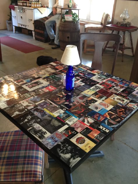 I tool old cassette tape covers glued them to a pub table and sealed it with epoxy for durability :-) Cassette Tapes Crafts, Old Cassette Tapes Crafts, Cassette Table, Ticket Stub Ideas, Glass Coffee Table Makeover, Western Vanity, Dvd Wall, Bar Top Ideas, Collage Table