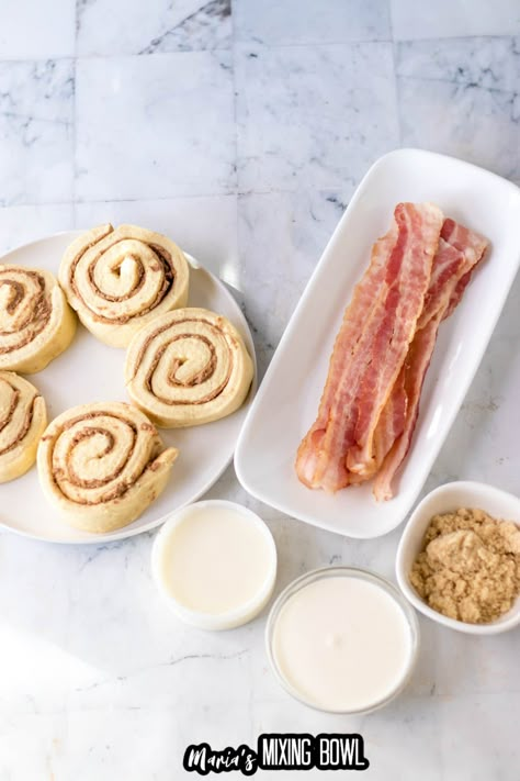 These bacon cinnamon rolls combine cinnamon rolls, bacon, whipping cream, and brown sugar to create a sweet and savory treat you'll love! Cinnamon Rolls With Bacon Inside, Bacon And Cinnamon Roll Twists, Cinnamon Rolls And Bacon, Cinnamon Bacon Twist, Bacon Cinnamon Rolls Pillsbury, Cinnamon Rolls With Bacon, Cinnamon Roll Bacon Twist, Bacon Wrapped Cinnamon Rolls, Bacon Cinnamon Roll Twists