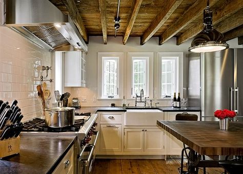 This was done in an old farmhouse that had really low ceilings. Basically, they took off the lowest part and cleaned/touched up the (I think 200 year old?) wood beneath it. Pretty cool, no? I thought it was a great rustic look. And it even goes well with the modern kitchen :D Kitchen Lighting Ideas For Low Ceilings, Soapstone Kitchen, Popular Kitchen Designs, Kitchen New York, Popular Kitchens, Kitchen Ceiling, Subway Tiles, Kitchen Farmhouse, Exposed Beams