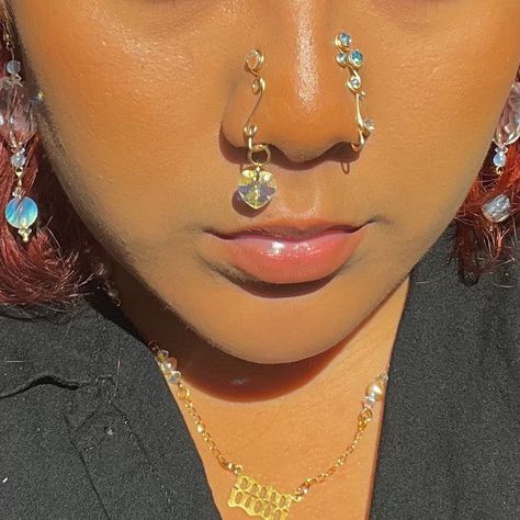 SCOR9IO ❤️WORLDWIDE SHIPPING❤️ on Instagram: “Big restock today!!! 10am PST 🫶🏽 and a couple new pieces dropping 🌈 . . . . . . . . . . . . . . . . . #nosecuff #nosecuffs…” Nose Ring With Dangle, Nose Cuffs Aesthetic, Crystal Nose Cuff, Dangling Nose Cuff, Gold Dangle Nose Ring, Nose Ring Cuff, Nose Ring Dangle, Crystal Nose Ring, Dangle Nose Rings