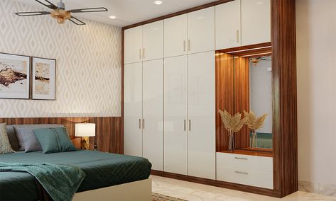 7 Fabulous White Wardrobe Design Ideas For Your Bedroom on Design Cafehttps://www.designcafe.com White And Brown Cupboards Bedroom, White And Wooden Wardrobe Design, White Sunmica Wardrobe, White Bedroom Wardrobe Ideas, Wood Colour Wardrobe Design, White And Wooden Wardrobe, White Wardrobe Design Bedroom, Ladies Wardrobe Design, White Wardrobe Bedroom Modern