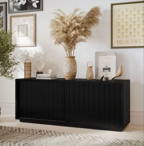 Love this affordable fluted tv stand. You won’t believe the price and 4.6 stars. Run on this deal. It won’t last Fluted tv stand / fluted cabinet/ modern furniture / black cabinet / walmart finds / target / drew Barrymore / toy storage Entertainment center / storage cabinet Follow my shop @blessedhouseofthree on the @shop.LTK app to shop this post and get my exclusive app-only content! #liketkit #LTKhome #LTKstyletip @shop.ltk https://liketk.it/4lQ05 Black Tv Console Living Room, Fluted Tv Stand, Living Room Design Black, Fluted Cabinet, Entertainment Center Storage, Tv Stand Decor Living Room, Stand For Tv, Storage Entertainment Center, Bedroom Tv Stand