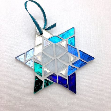 Shimmering blue, teal and silver mirror glass create striking mosaic art Star of David hanging ornaments - a unique gift for a holiday party, these handcrafted mosaic ornaments will bring a touch of sparkle to your Festival of Lights celebration- a special Hanukah gift. Charming to give as a hostess Mosaic Ornaments, Mosaic Star, Jewish Crafts, Teal And Silver, Chanukah Decor, Hanukkah Decorations, Mosaic Art Projects, Fort Pierce, Bat Mitzvah Gifts