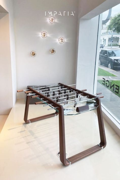 A modern custom designed foosball table made from walnut with a transparent glass playing field. Dutch Colonial Interior, Aesthetic Arcade, Modern Game Room, Snooker Room, Foosball Tables, Colonial Interior, Chill Zone, Foosball Table, New Business Ideas