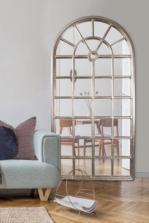 The Howard Elliott Mirabel Mirror features an oversized arched shape in a timeless window pane design. It is finished in a lovely champagne silver leaf. #HowardElliott | #HowardElliottMirror | #FloorMirror Champagne Mirror, Window Pane Mirror, Large Floor Mirror, Arched Mirror, Floor Mirrors, White Windows, Wood Windows, Window Pane, Mirrors For Sale