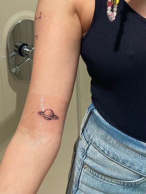 Saturn And The Moon Tattoo, Saturn Aquarius Tattoo, Saturn Simple Tattoo, Cute Saturn Tattoos, Saturn Planet Tattoo, Moon And Saturn Tattoo Taylor Swift, Small Saturn Tattoo, Saturn Tattoo Minimalist, Small Planet Tattoo