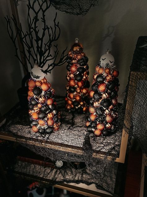 These spooky Halloween ornament trees are sure to add a touch of frightful glamour to your Halloween decor; try placing them on tiered candle holders or just display as they are on your mantle or shelf! Size: 2 Larger Trees: 11.5"H x 4.5"W 1 Smaller Tree: 10:H x 5"W Spooky Trees For Halloween, Halloween Ornaments Tree, Tiered Candle, Ornament Trees, Mickey Wreath, Halloween Decor Diy, Rustic Halloween, Spooky Trees, Halloween Garland