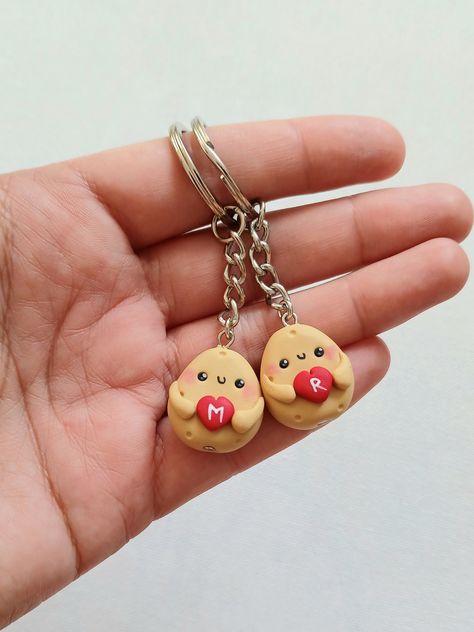 Cute potato keychains for best friends or couples. The charms measure about 2 cm and are made by hand, from polymer clay. Since we do not use molds or forms, the models may slighly vary from the picture. You can order one keychain or a set of more keychains. Please fill the desired letters with your order. * Each product comes in a cute packaging. * Visit our shop to see all the products: https://www.etsy.com/shop/nahootdesignshop/?etsrc=sdt Couple Keychains Clay, Best Friends Clay Ideas, Matching Crafts For Friends, Couple Clay Keychain, Clay Keychain Diy Best Friends, Couples Clay Ideas, Air Dry Clay Ideas For Boyfriend, Couple Clay Ideas, Couple Clay Art