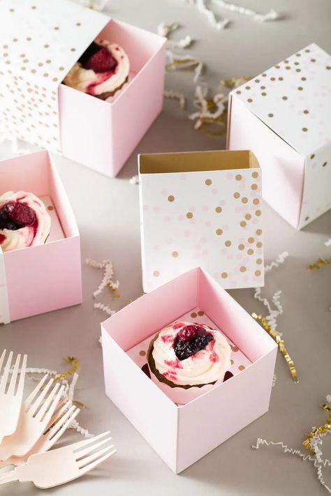 Treat your guests to a sweet treat when you give them Pink & Gold Confetti Cupcake Boxes with cupcakes inside! Made of cardstock, these treat boxes feature a sleeve with pink and gold confetti printed against a white background and a light pink sleeve that holds the cupcake in place. First Birthday Brunch, Gold Favor Boxes, Confetti Cupcakes, Cupcake Container, Pink Favours, Gold Cupcakes, Cupcake Gift, Pink Confetti, Birthday Brunch