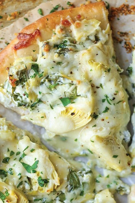 35 Pizza Topping Ideas That Are Way More Exciting Than Plain Ol' Pepperoni #purewow #pizza #dinner #cooking #recipe #family #food Artichoke Dip Pizza, Pizza Stromboli, Creative Pizza, Spinach And Artichoke Dip, Pizza Roll, Naan Pizza, Four A Pizza, Artichoke Recipes, Pizza Recipes Homemade