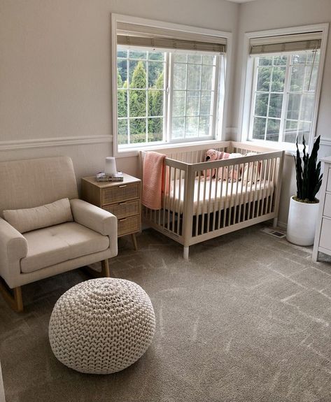 Oatmeal rocker and pouf, light wood side table and crib, snake plant and more complete this nursery's neutral aesthetic Light Wood Side Table, Boho Baby Girl Nursery, Boho Baby Girl, Wood Side Table, Neutral Aesthetic, Baby Girl Nursery, Side Table Wood, Snake Plant, Boho Baby