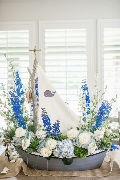 Boat Floral Arrangement, Ship Centerpiece Ideas, Boat Flower Arrangement, Nautical Baby Shower Centerpiece Ideas, Coastal Grandmother Baby Shower Theme, Baby Boy Shower Flower Arrangements, Ocean Theme Flower Arrangements, Boy Baby Shower Flower Centerpieces, Flowers For Baby Shower Boy