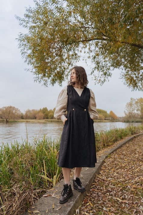 "This black linen pinafore dress is perfect for a dark academia style. Our modest dress can be worn all year round, as a sundress in summer or with a shirt or blouse in winter season. Charming drapery and pleated skirt give this look cottage core aesthetic. DETAILS: * medium weight linen fabric; * black color;  * sleeveless; * A-line skirt with bow folds;  * side seem pockets;  * midi length;    70 cm /27,6\" from the waist line (another length is possible) ;    MATERIAL: * 100% linen (flax); * Black Cottage Dress, Plus Size Outfits Dark Academia, Cottage Core Midsize, Midsize Modest Outfits, Midsize Dark Academia, Summer Dark Academia Outfit, Dark Academia Outfit Plus Size, Dark Cottagecore Outfits, Cottage Core Academia