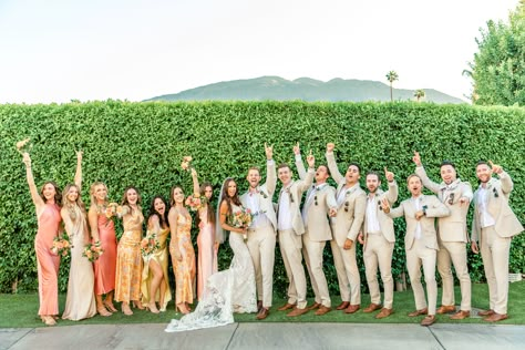 Colorful Bridal Party in the beautiful Omni Rancho Las Palmas Pink And Yellow Groomsmen, Colorful Bridesmaids And Groomsmen, Colorful Wedding Bridal Party, Colored Groomsmen Attire, Sunset Wedding Groomsmen, Multi Colored Bridal Party, Pastel Bridal Party Groomsmen, Garden Party Groomsmen, Garden Party Wedding Groomsmen