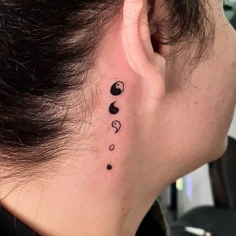 Deconstructed Yin-Yang Tattoo. A deconstructed yin-yang design is a great choice for those who want to go deeper into the symbolism and highlight each part. Click through for 25 yin-yang tattoo ideas. #yinyangtattoo #tattooideas #tattoo IG: @taginktattoo Yin Yang Tattoo Behind Ear, Ying Yang Neck Tattoo, Ying Yang Tattoo Neck, Ying Yang Tattoo Behind Ear, Duality Tattoo Ideas, Yin Yang Tattoo Ideas, Vertical Tattoo, Ying Yang Tattoo, Yang Tattoo