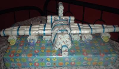 This is a cake I made for a friend for her neice's baby shower.  I rolled each diaper as you see on most of the rolled cakes they are the Huggies Pure Airplane Diaper Cake, Airplane Baby Shower, Diaper Gifts, Diaper Cake Boy, Airplane Baby, Nappy Cakes, Baby Shower Crafts, Baby Shower Diaper Cake, Diy Baby Shower Gifts