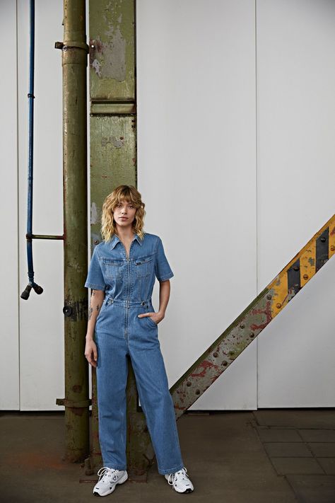 Experience timeless 1970s style with our denim overalls. The loose fit, zip-through placket, and slanted yoke exude retro vibes. Button-down chest pockets and ankle hems add extra charm to these indigo denim overalls. Crafted with stretch for comfort and a beautiful drape, they feature a super dark finish that recalls 1990s edge. Embrace the boot cut and low rise design for a fashionable statement. Step into these iconic overalls and rock the perfect blend of comfort and style! 1970s Style, Super Dark, Bleached Denim, Indigo Denim, Jean Overalls, 1970s Fashion, Beautiful Drapes, Lee Jeans, True Blue