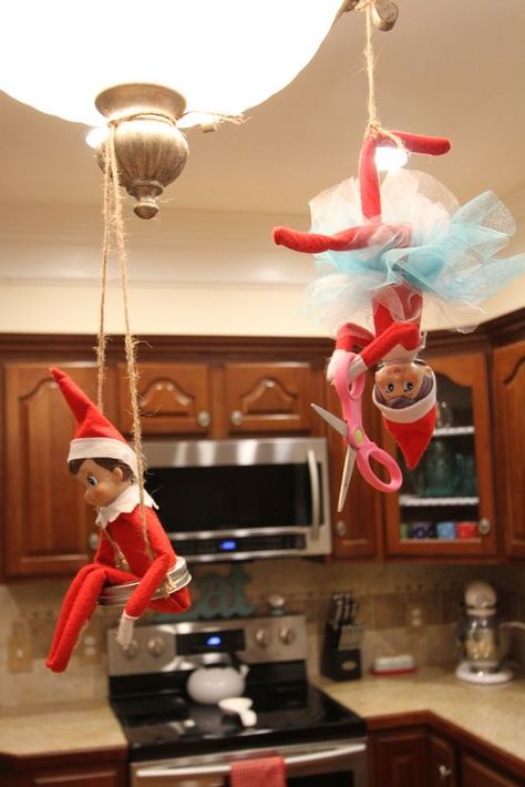 Like Mom And Apple Pie: Elf On The Shelf - Why We Have 2 Elves and So Should You... 2 Elf Ideas On The Shelf, Elf Hanging From Ceiling Fan, Elf On The Shelf Hanging Ideas, Elf In The Shelf Ideas, Hanging From Ceiling, Elf Fun, Dining Lighting, Shelf Ideas, The Elf