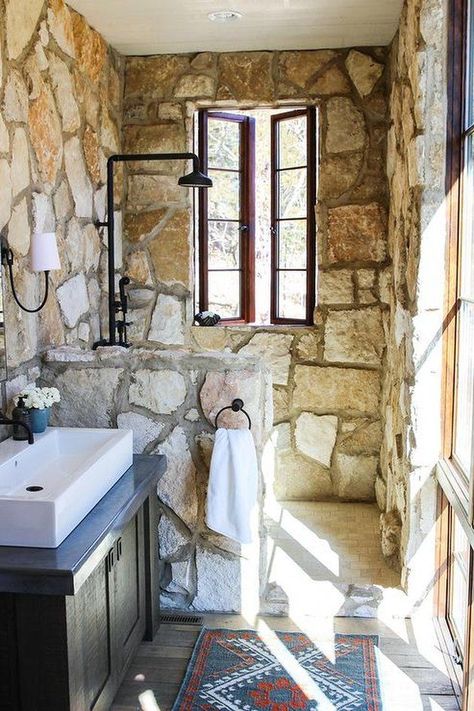 Some of the chicest city bathrooms feature rustic accents, and they don't sacrifice modernity for texture and character. Here are some of our favorite ways to incorporate the tile in your space. #hunkerhome #bathroom #shower #rustic #rusticshowerideas Rustic Shower Tile, Rustic Cottage Bathroom, Cottage Bathroom Ideas, Rustic Shower, Stone Shower, Stone Bathroom, Cottage Bathroom, Shabby Chic Bathroom, Rustic Stone