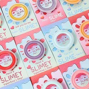 Package includes 12 valentines day cards , 12 slime , 12 clear bags ,and accessories(12 packs sprinkles and 12 packs small candy toy molds). Cards feature sweet pun messages “Happy Valen-SLIME Day!” “Have a SLIMEY Valentine's Day!” “You are SILME-tastic!" “Will you be my Valen-SLIME?" Slime Packaging, Sweet Puns, Slime Package, Valentines Day Gifts For Kids, Diy Butter, School Party Favors, Butter Slime, Slime Kit, Kids Classroom