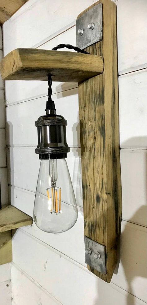 Beautiful oak whiskey barrel stave wall light complete with nickel holder ( bulb not inc) can be made to customer requirements flush fit to wall comes with antique braided cable made from reclaimed Scottish whiskey barrels from Stirlingshire https://furnishwithlightart.patternbyetsy.com Barrel Stave Wall, Scottish Whiskey, Wooden Beams Ceiling, Rustic Ceiling Lights, Whiskey Barrels, Rustic Ceiling, Barrel Stave, 3 Light Chandelier, Scotch Whiskey