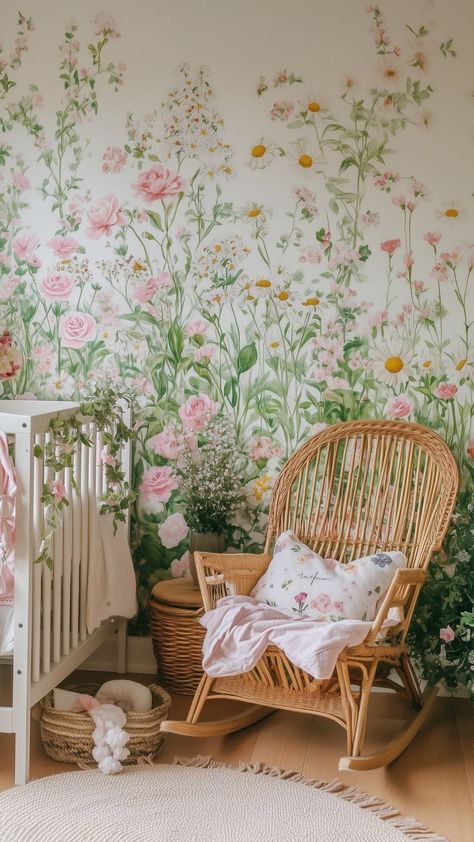 nursery with floral mural and wicker rocking chair Garden Nursery Ideas Plants, Garden Theme Nursery Girl, Wild Flower Baby Nursery, Baby Girl Wildflower Nursery, Baby Girl Nursery Wildflower, Whimsical Nursery Room Inspiration, Flower Nursery Baby Girl, Whimsical Nursery Ideas, Garden Baby Nursery