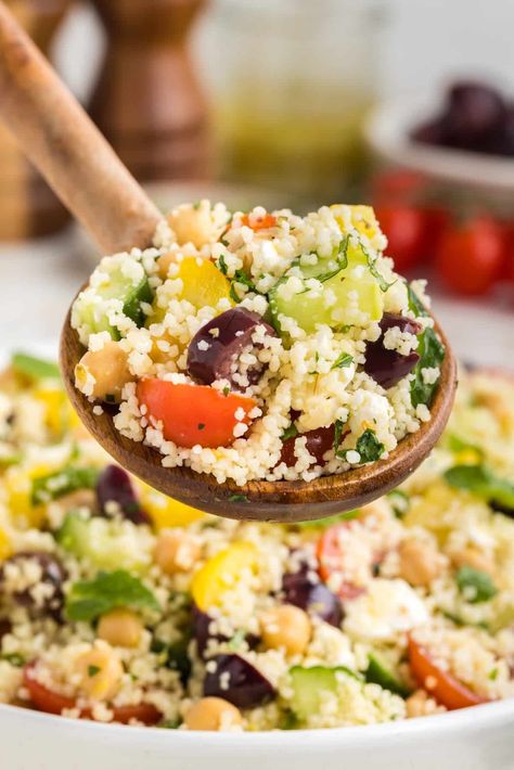 This couscous salad has a combination of Mediterranean flavors with olives, cucumbers, fresh herbs, feta cheese, and a tangy dressing. It's a great side dish for potlucks, picnics, BBQs, and other summer get-togethers! Couscous Mediterranean, Lemon Herb Dressing, Mediterranean Couscous Salad, Mediterranean Couscous, Semolina Pasta, Herb Dressing, Resep Salad, Couscous Salat, Couscous Recipes