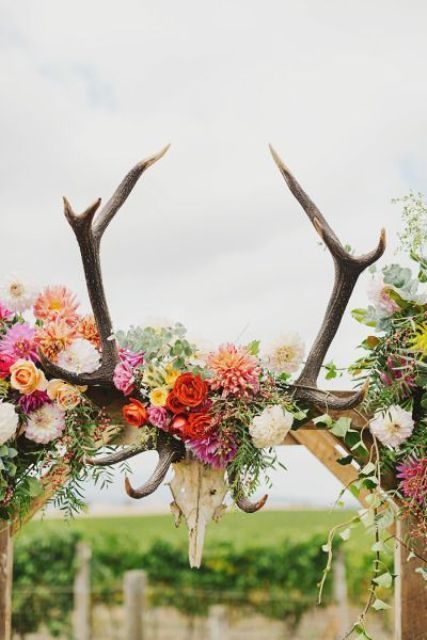 a bold floral wedding arch with a skull and antlers for a boho feel Vintage Country Weddings, Boho Wedding Ceremony, Antler Wedding, Wedding Arch Rustic, Romantic Wedding Receptions, Flowers And Greenery, Rustic Wedding Signs, Wedding Floral Centerpieces, Rustic Wedding Diy