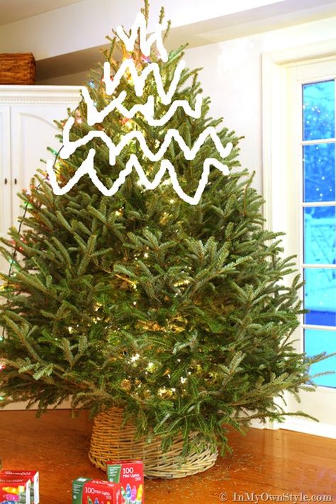 How-to-string-lights-on-a-Christmas-Tree-the-easy-way Lights On Christmas Tree, Christmas Tree Decorating Tips, Christmas Lights Outside, Christmas Light Installation, Hanging Christmas Lights, Lighting Tips, Inflatable Decorations, Hanging Christmas Tree, Tree Lights