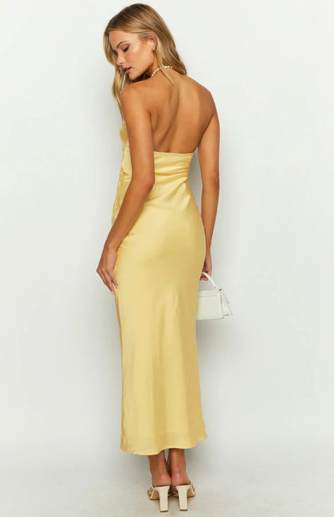 Yellow Satin Maxi Dress HOW TO STYLE: The most elegant for your next cocktail or occasion. Pair with white and clutch to complete this look for your next event. FEATURES: Invisible side zip Maxi length Strapless neckline Lined Gathered bust with cut ou Light weight satin material Bias cut fabric with slight stretch