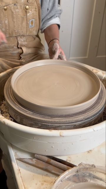 Elyssa Sasongko on Instagram: "My plate throwing and trimming process! I have discovered a new trick with trimming my plates. I found out that laying down a microfiber cloth is a game changer! You put it down on the wheel first, then put your plate on top of it and the plate won’t budge. I’ve only tried it with plates so far but I’m going to be doing some experimenting with smaller things in the near future. Keep y’all posted! #pottery #potterywheel #potteryofinstagram #potteryoftheday #potte Plate Throwing, Jungkook Photoshoot, My Plate, First Then, Deep Plate, Near Future, Large Plates, Thrown Pottery, Pottery Plates