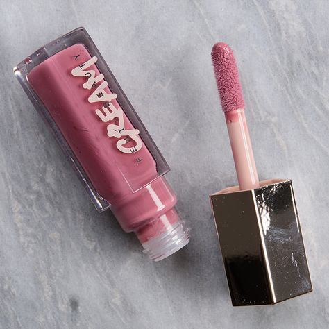 Fenty Beauty Mauve Wives Gloss Bomb Cream ($19.00 for 0.3 oz.) is a muted, medium mauve with subtle, cool undertones and a glossy, cream finish. It had semi-opaque pigmentation in one layer, which applied evenly and spread easily across my lips, but there was a bit of product that settled into my lip lines--not quite enough to be noticeable from a normal viewing distance. The texture was non-sticky, smooth, and plush without being too thick, though I felt like it was thicker than ideal for build Fenty Beauty Lip Gloss Mauve Wives, Fenty Beauty Cream Gloss, Mauve Wives Fenty, Fenty Mauve Wives, Fenty Cream Gloss, Honey Waffles, Alat Makeup, Makeup Pallets, Matte Lip Gloss