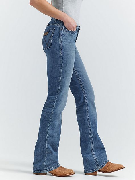 MADE FOR THE ULTIMATE RIDEAllow us to introduce you to Jade—part of the Women's Wrangler® Ultimate Riding Jean collection. This mid-rise relaxed bootcut jean for women is made of a comfortable cotton blend with stretch to keep up with riding, showing, and working. It's enhanced with a slightly pitched waistband that sits lower in the front and higher in the back for maximum comfort and coverage in the saddle as well as our signature no-gap waistband and flat comfort seams. The fit is a little looser for enhanced comfort. It comes with our signature five-pocket styling and "W" embroidery for marks of authenticity. Affordable Bootcut Jeans, Jeans And Boots Women, Petite Bootcut Jeans, Cute Bootcut Jeans, High Waisted Bootcut Jeans Outfit, Western Jeans Womens, Flare Jeans Country, Farm Work Outfit, Women’s Jeans